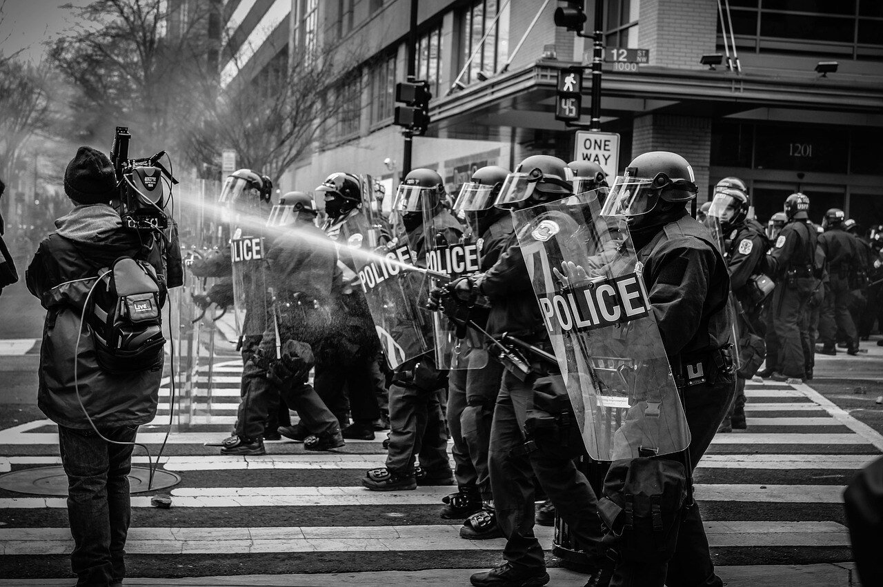 Police managing a protest in the street